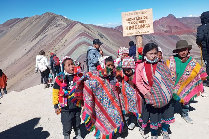 Colorful Mountain In The Cusco Region - Rainbow Mountain payoff: colors, snow, small lakes, and wildlife